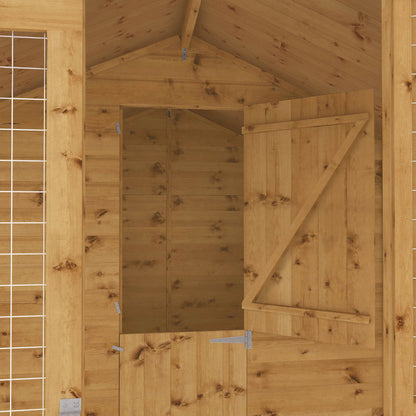 Interior of wooden dog kennel with internal access door